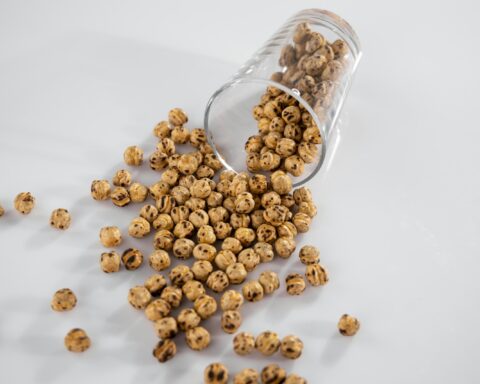 brown coffee beans in clear glass jar